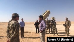 FILE - U.S. Defense Secretary Mark Esper speaks with U.S. troops in front of a Patriot missile battery at Prince Sultan Air Base, October 22, 2019