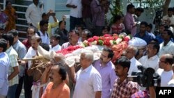 Relatives carry the body of Indian engineer Srinivas Kuchibhotla, who was shot dead in Kansas, during his funeral in Hyderabad on February 28. 