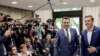 Macedonian Prime Minister Zoran Zaev (left) and his Greek counterpart Alexis Tsipras smile for reporters at a meeting in Sofia on May 17. 