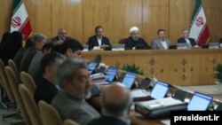 A handout picture provided by the office of Iranian President Hassan Rouhani on September 13, 2017 shows him (3nd R) sitting next to Vice President Eshaq Jahangiri (2nd L) during a cabinet meeting in Tehran.