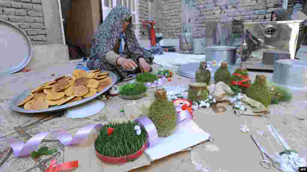 Afghanistan -- A woman prepares decorations for the new year in Herat city, 19Mar2012