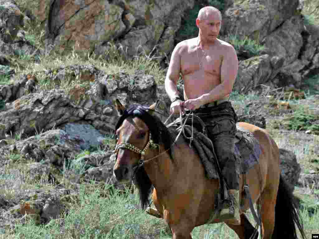 A shirtless Prime Minister Vladimir Putin rides a horse during a vacation in the Russian Republic of Tuva in August 2009.