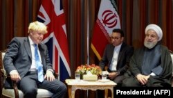 Iranian President Hassan Rohani (R) meets with British Prime Minister Boris Johnson on the sidelines of UNGA in New York, September 24, 2019. File Photo