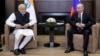 Russian President Vladimir Putin (right) meets with Indian Prime Minister Narendra Modi in the Black Sea resort of Sochi on May 21.