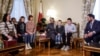 Qatar's ambassador to Russia (center) and the head of Russian president's Office of the Commissioner for Children's Rights meet with Ukrainian children and family members before their departure to Ukraine from Russia under a deal brokered by Qatar at its embassy in Moscow in December 2023.