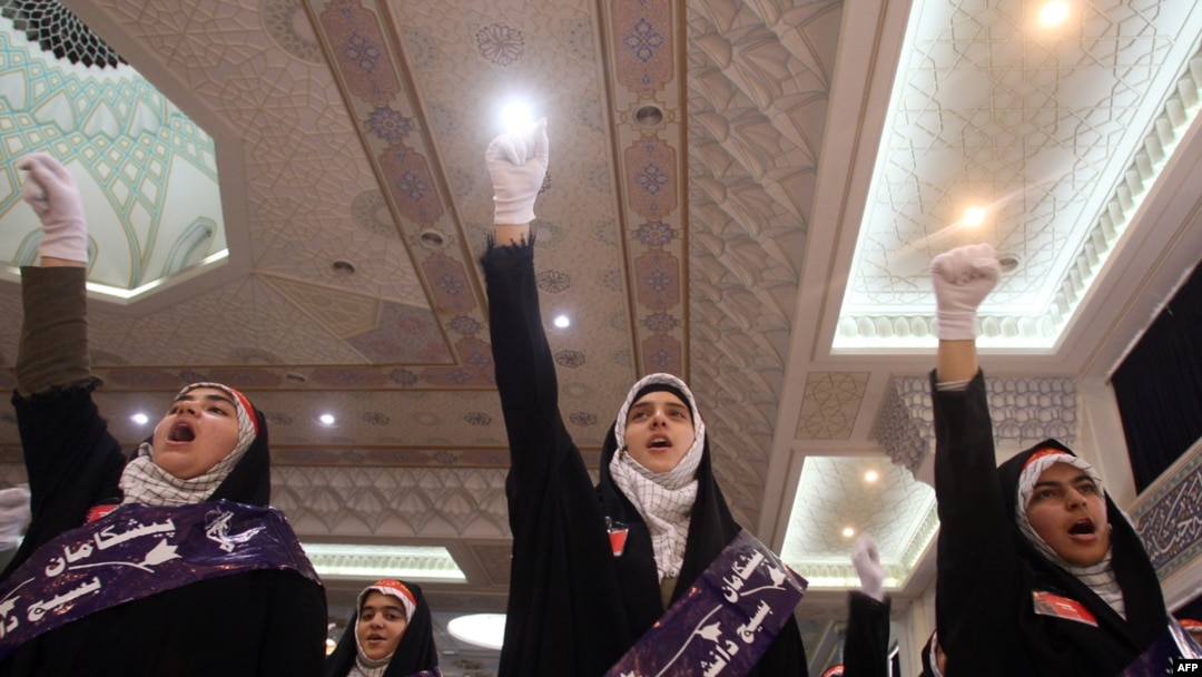 Female members of the Basij Islamist militia shout slogans during a ceremony marking the 30th anniversary of its establishment at the Imam Khomeini Grand Mosque in Tehran last year.