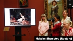 Participants attend a news conference on May 28 dedicated to the damaged painting Ivan The Terrible And His Son Ivan after a visitor recently attacked it with a metal post, at the State Tretyakov Gallery in Moscow.