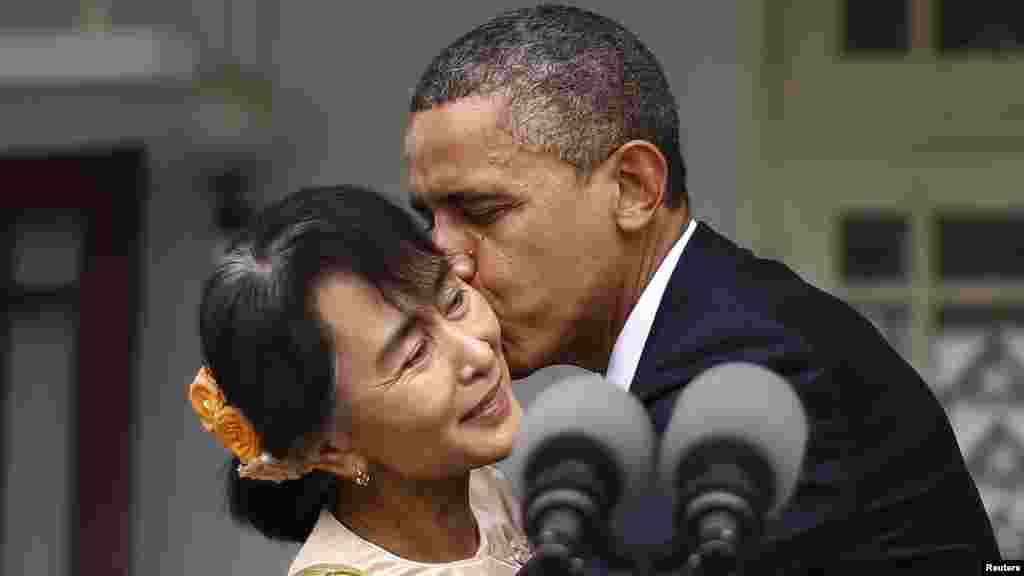 U.S. President Barack Obama kisses Aung San Suu Kyi during a visit to her residence in Yangon, Burma, on November 19. 