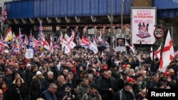 Protesters in London take part in an anti-immigration demonstration organised by Tommy Robinson supporters. February 1, 2025.