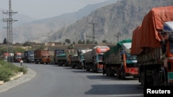Trucks loaded with supplies bound for Afghanistan are seen stranded at the Michni check post in Torkham, Pakistan, on September 7.