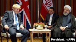 Iranian President Hassan Rohani (R) meets with British Prime Minister Boris Johnson on the sidelines of the 74th United Nations General Assembly in New York, September 24, 2019
