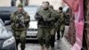 The leader of the self-proclaimed Donetsk People's Republic, Aleksandr Zakharchenko (center), walks in downtown Donetsk with other separatist rebels.