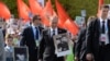 RUSSIA – Russian President Vladimir Putin (C) carries a portrait of his father as he takes part in the Immortal Regiment march during the Victory Day celebrations in Moscow on May 9, 2015