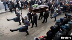 Pallbearers carried the coffin during funeral honors on January 2 for a police officer killed by the suicide bomb blast in the city main railway station in Volgograd.