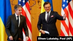 Ukrainian Foreign Minister Dmytro Kuleba (right) welcomes U.S. Secretary of State Antony Blinken during their meeting in Kyiv on May 6.