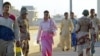 Pedestrians and military personnel walking over a bridge in Baghdad's Green Zone (file photo)