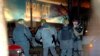 Russian police stand outside the Dubrovka theater in Moscow after Chechen extremists stormed the building and took between 900 and 1,000 people hostage on the evening of October 23, 2002.&nbsp;