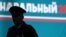 A police officer is silhouetted during an anti-corruption rally in St. Petersburg. The Russian Prosecutor-General's Office reported that the most frequent cases of alleged corruption so far this year had been registered among law enforcement officers. (file photo)
