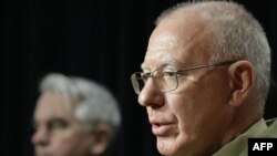 "A hard day in theater": Lieutenant General David Hurley (right) briefs reporters on the loss of Australian soldiers in Afghanistan.