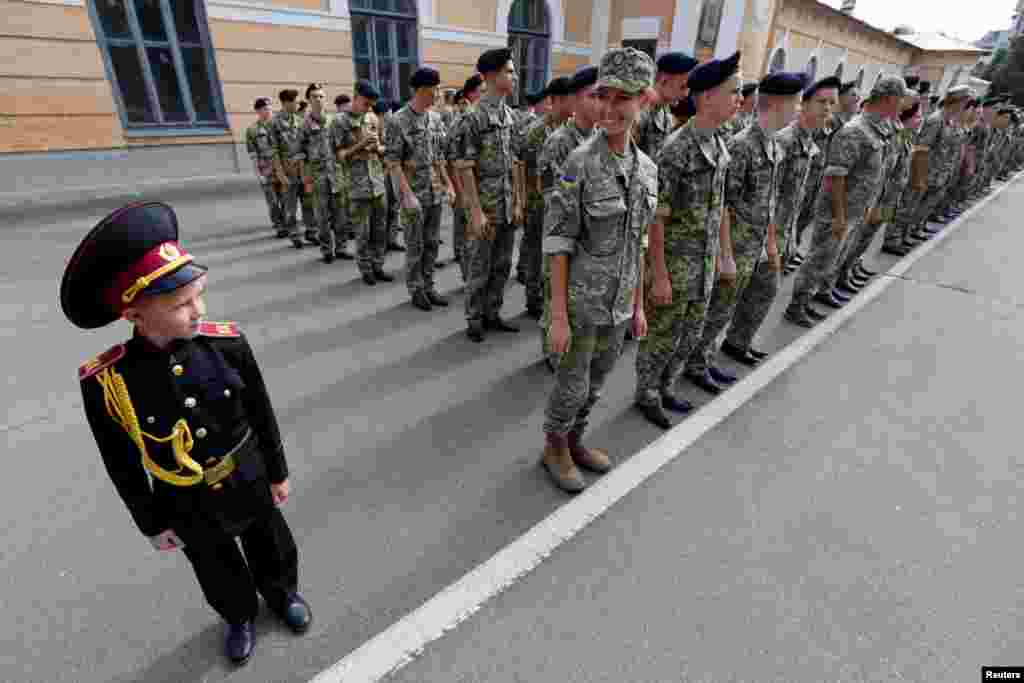 Students of a cadet school attend a ceremony to mark the start of a new school year in Kyiv on September 1. (Reuters/Valentyn Ogirenko)