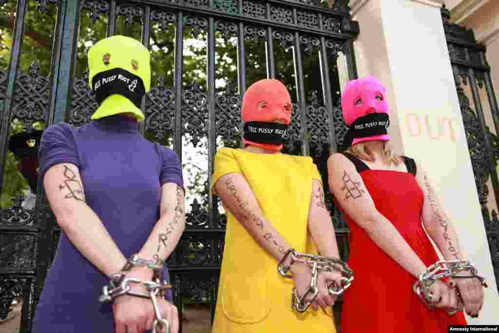 Protesters join a demonstration in support of Pussy Riot led by rights watchdog Amnesty International near the Russian Embassy in London on August 16.