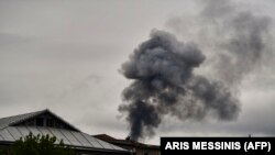 NAGORNO KARABAKH -- Smoke rises behind houses after shelling in Stepanakert on October 7, 2020,.