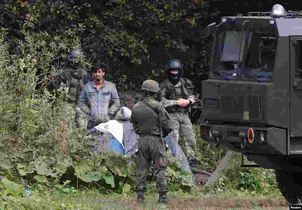 A migrant on the border with Belarus on August 23. The man is part of a group of migrants claiming to be from Afghanistan caught in a bizarre standoff between Polish and Belarusian border guards. &nbsp; &nbsp;