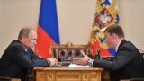 RUSSIA -- Russian President Vladimir Putin (L) and Pskov region governor Andrei Turchak meet for talks at Novo-Ogaryovo residence, December 16, 2013