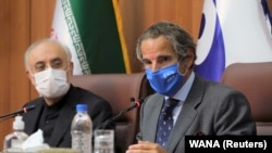 International Atomic Energy Agency Director General Rafael Grossi (R) speaks during a press conference with Iranian Atomic Energy Organization chief Ali-Akbar Salehi in Tehran, Iran August 25, 2020.