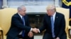 U.S. President Donald Trump shakes hands with Israel's Prime Minister Benjamin Netanyahu in the Oval Office of the White House in Washington, March 5, 2018