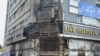 A building housing a bank is seen on November 17 after it was attacked during protests in Iran.