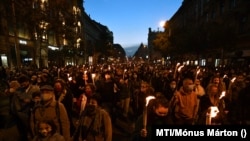 Protesters in Budapest carried torches and banners.