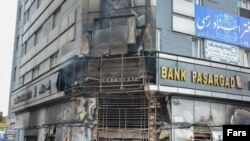 A building housing a bank is seen on November 17 after it was attacked during protests in Iran.