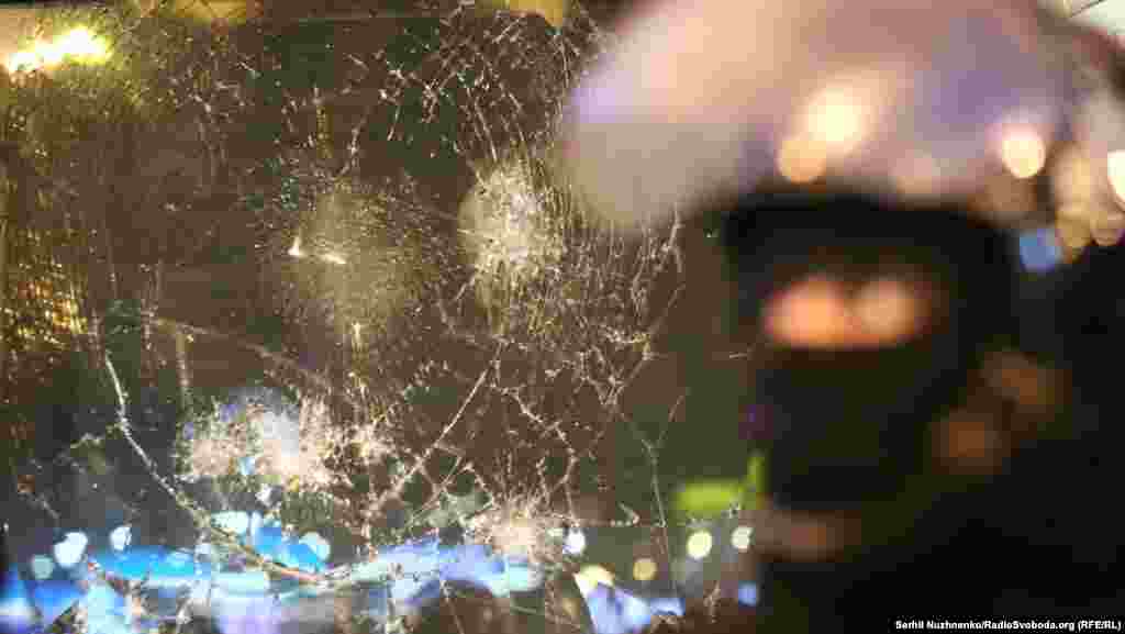 Protestors smashed windows and also tore down the Alfa Bank sign on the building.