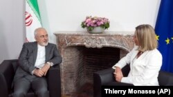 BELGIUM -- European Union foreign policy chief Federica Mogherini (R) meets with Iranian Foreign Minister Javad Zarif prior to a meeting of the E-3 and Iran at the Europa building in Brussels, May 15, 2018