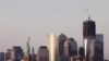 U.S. -- The Statue of Liberty (L) and One World Trade Center (R) frame the New York skyline, 23Aug2011