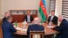 Representatives of the ethnic Armenian community of Nagorno-Karabakh, Azerbaijan's government, and a representative of the Russian peacekeeping contingent attend talks in the Azerbaijani city of Yevlax on September 21.