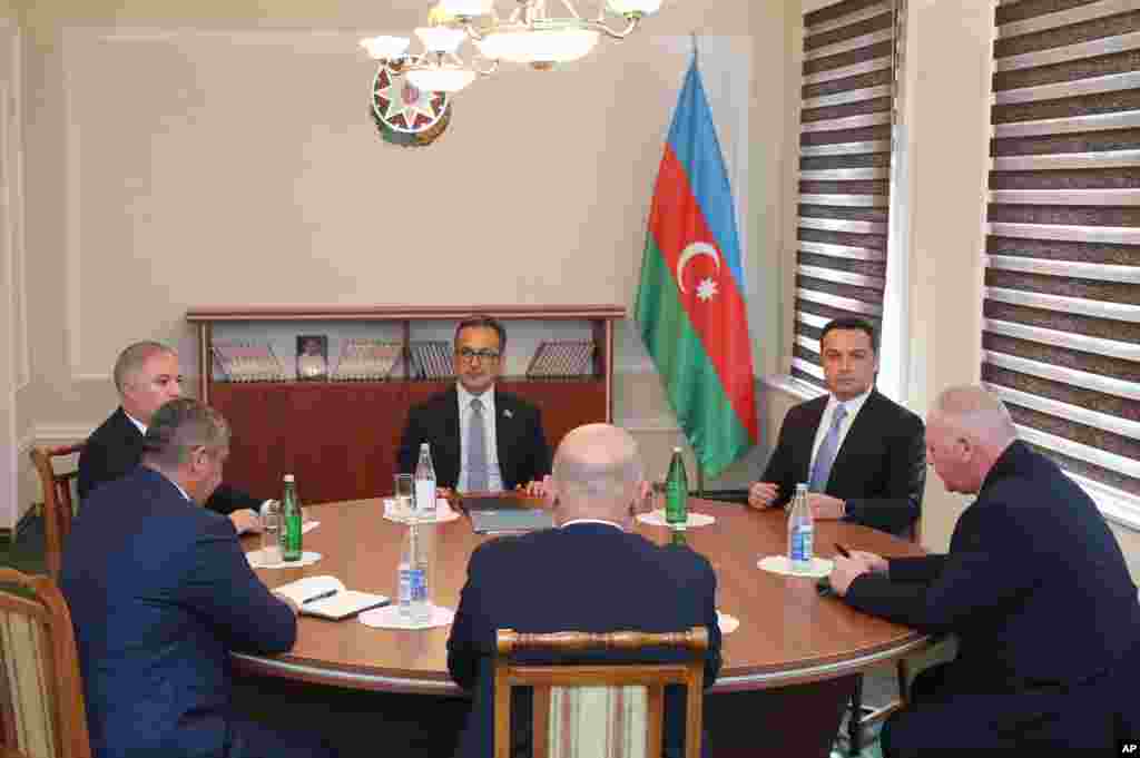 Representatives of Nagorno-Karabakh, Azerbaijan&#39;s government, and the Russian peacekeeping contingent are seen at &quot;reintegration&quot; talks in Yevlax on September 21. The talks ended with no public statements nor any sign of a breakthrough. The talks followed Azerbaijani President Ilham Aliyev&#39;s boast to his oil- and gas-rich nation of 10 million after a Russian-brokered cease-fire halted intense fighting on September 20 that he said had &quot;restored its sovereignty.&quot; The meeting came as part of the truce for what the Azerbaijani side calls talks on &quot;reintegration&quot; of the territory into the rest of the country after decades of occupation.