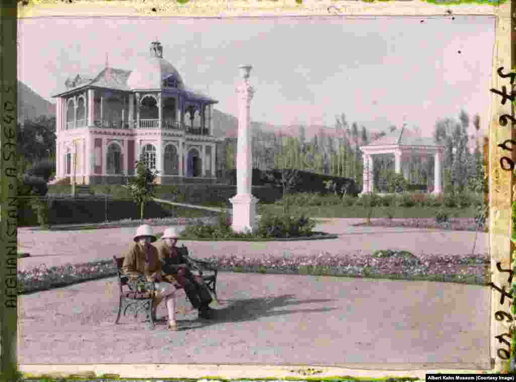 Pith-helmeted visitors in front of a tea house in the hills west of Kabul.