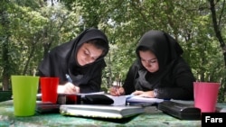 One women's rights activist says the new official figures suggest that efforts by Iran "to eliminate women from universities" have been successful.