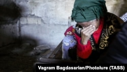 A woman cries in a bomb shelter during fighting over the breakaway region of Nagorno-Karabakh in Shushi on October 8.
