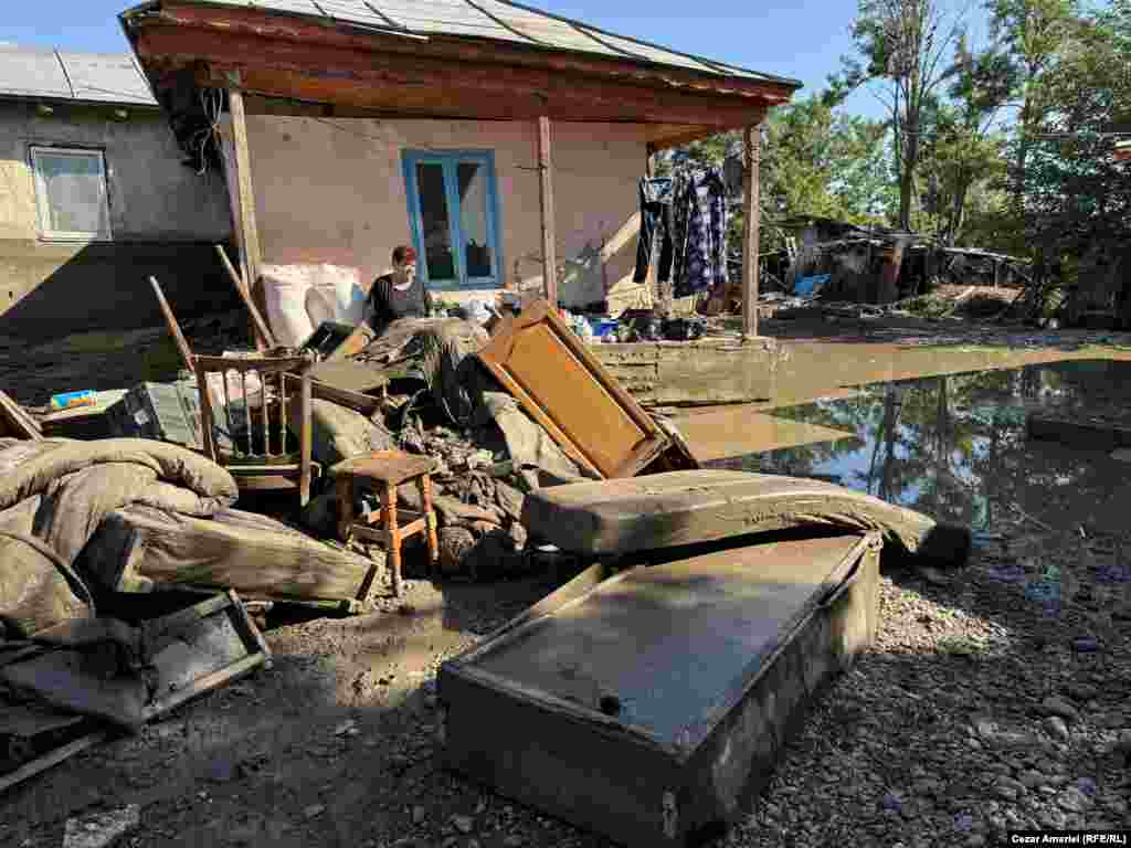 Residents in the Romanian town of Slobozia Conachi in Galați County clean up after floodwaters inundated their homes. More than 700 homes were affected by the disaster.