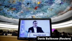 Seyyed Ali Reza Avayi, Minister of Justice of Iran appears on screen as he attends the Human Rights Council at the United Nations in Geneva, Switzerland, February 27, 2018.