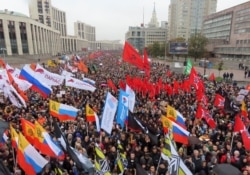 People attend a rally to demand the release of jailed protesters in Moscow on September 29.