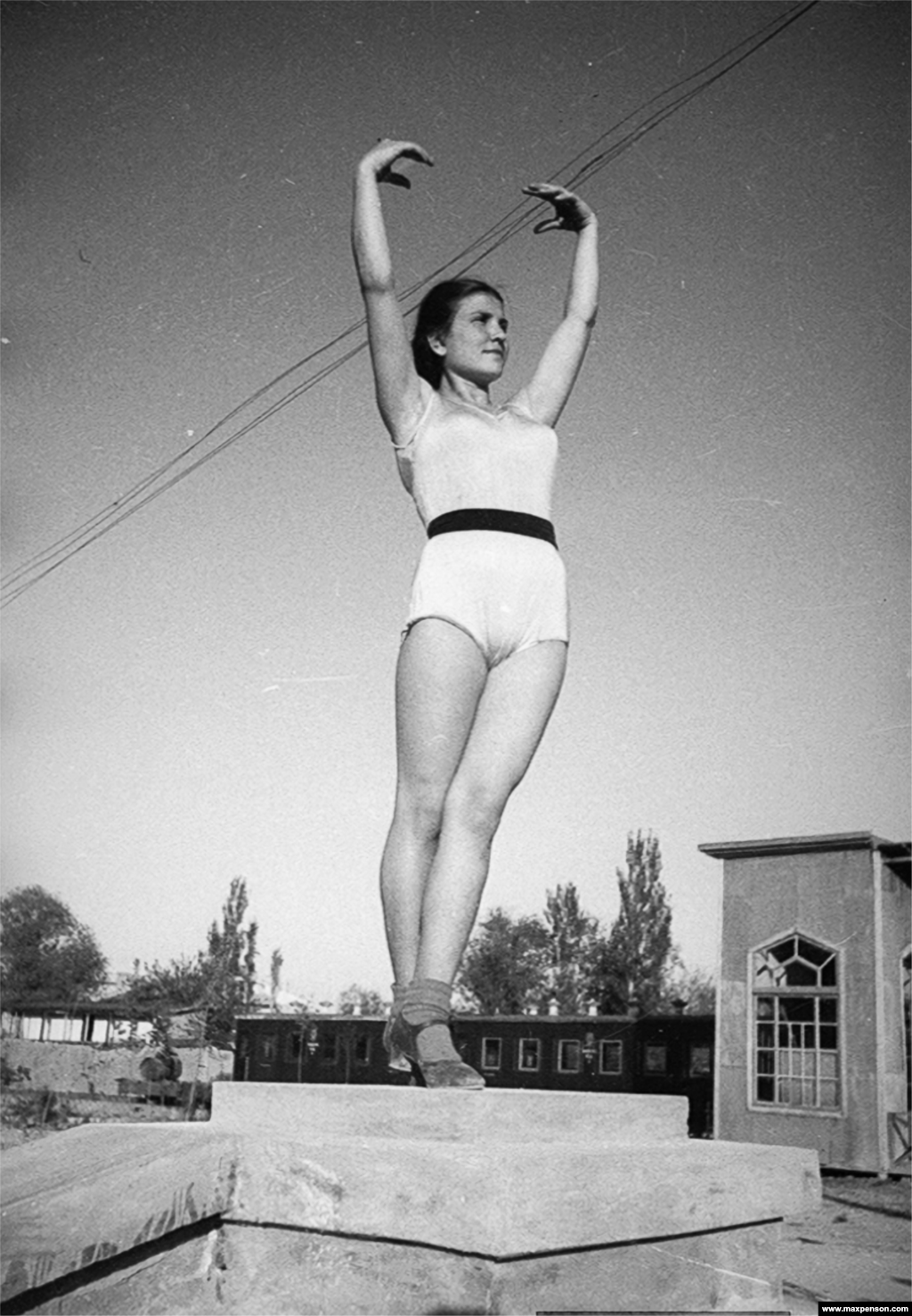 A gymnast poses near Komsomol Lake in Old Tashkent. By the end of the war, the anti-Semitism that had driven Penson from his homeland was rearing its head across the U.S.S.R.