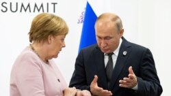 Angela Merkel i Vladimir Putin, susret u Osaki, jun 2019.