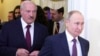Russian President Vladimir Putin (right) and Belarusian President Alyaksandr Lukashenka attend a meeting of the Supreme Eurasian Economic Council in St. Petersburg in December 2019.