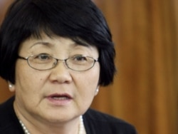 Interim leader Roza Otunbaeva praised the work of the international investigation as "important and necessary." She's shown here during a meeting with human rights activists in Bishkek on June 11, 2010.