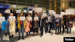 Friends and supporters of Shahab Dehghani, an Iranian student facing deportation from the United States, protesting at Boston's Logan Airport on January 20.