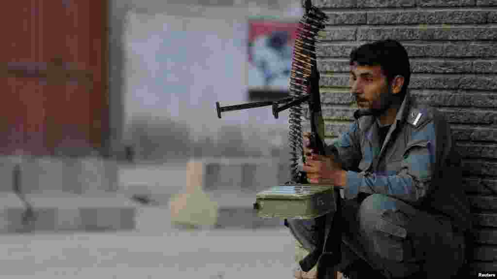 An Afghan policeman guards a site in Kabul on April 15. (REUTERS/Omar Sobhani)